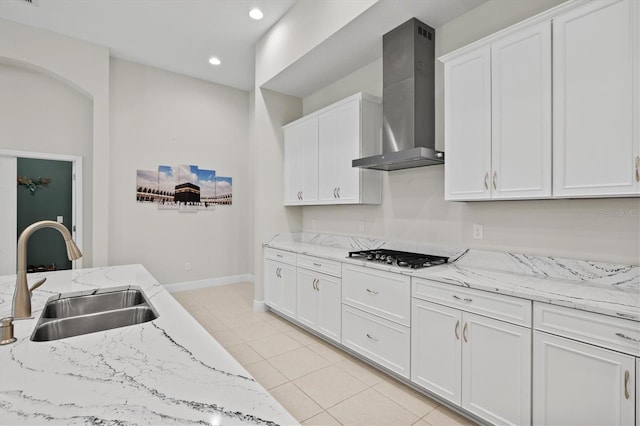 14607 Swiss Bridge Dr, Lithia, FL 33547 - kitchen featuring gas cooktop, wall chimney exhaust hood, white cabinets, and a sink