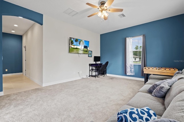 14607 Swiss Bridge Dr, Lithia, FL 33547 - living room featuring arched walkways, carpet flooring, a ceiling fan, and visible vents