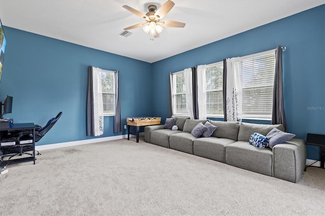 14607 Swiss Bridge Dr, Lithia, FL 33547 - living area featuring baseboards, visible vents, ceiling fan, and carpet