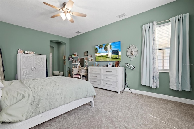 bedroom with ceiling fan and light colored carpet