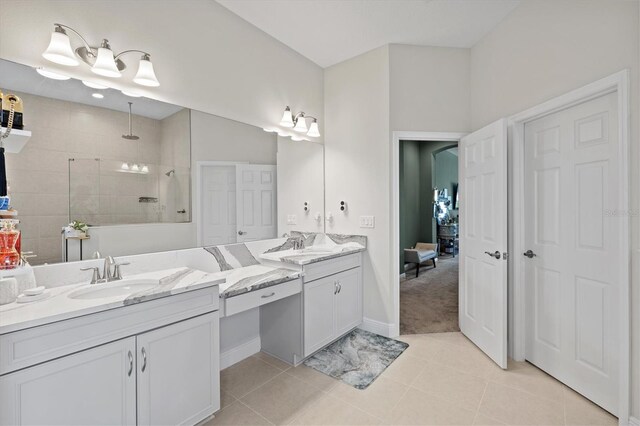 14607 Swiss Bridge Dr, Lithia, FL 33547 - bathroom featuring baseboards, a walk in shower, tile patterned flooring, and vanity