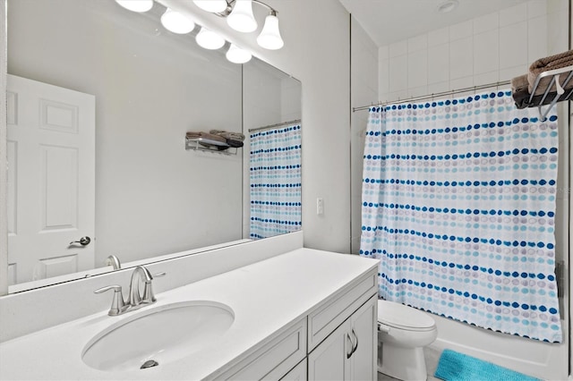 full bathroom featuring shower / tub combo, vanity, and toilet