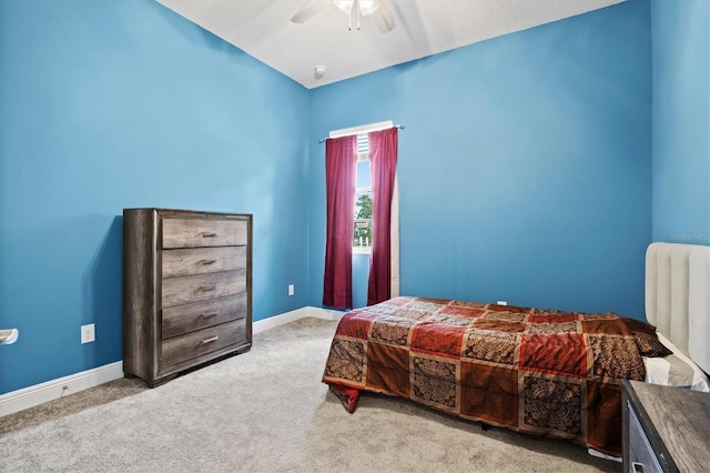 bedroom featuring ceiling fan and carpet floors