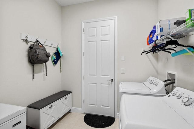 14607 Swiss Bridge Dr, Lithia, FL 33547 - washroom featuring light tile patterned floors, laundry area, and washer and clothes dryer