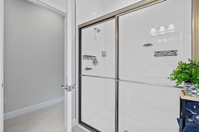 bathroom with walk in shower and tile patterned floors