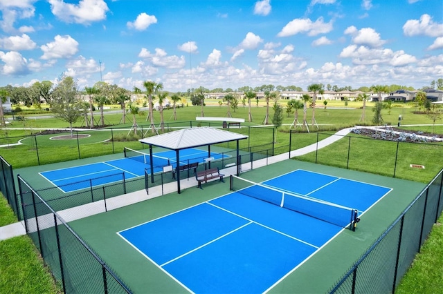 14607 Swiss Bridge Dr, Lithia, FL 33547 - view of sport court with fence and a yard