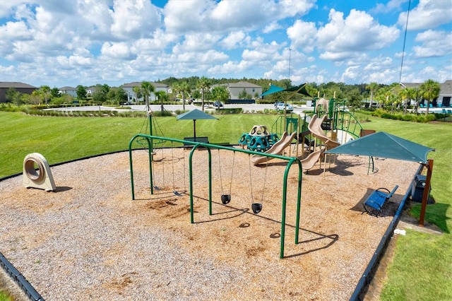 view of property's community with a playground and a lawn