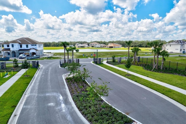 14607 Swiss Bridge Dr, Lithia, FL 33547 - view of street with a residential view, sidewalks, and a water view