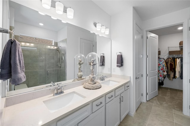 bathroom with vanity, an enclosed shower, and tile patterned flooring