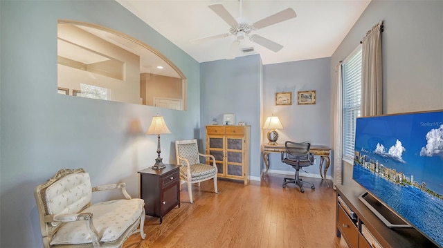 sitting room featuring light hardwood / wood-style floors and ceiling fan