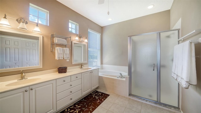 bathroom featuring tile patterned flooring, vanity, and independent shower and bath