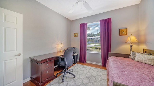 bedroom featuring ceiling fan and light hardwood / wood-style flooring