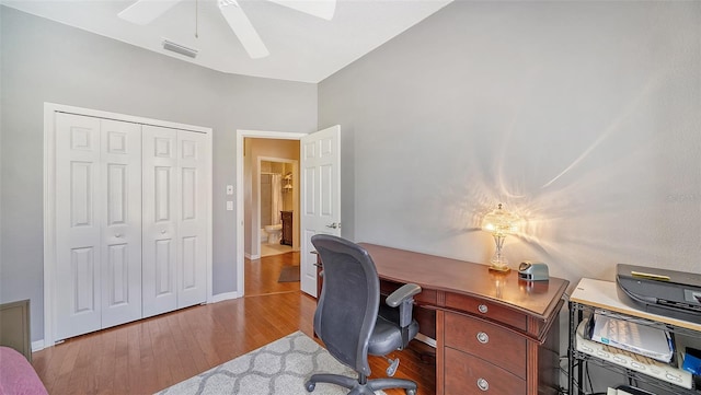 office area with light wood-type flooring and ceiling fan