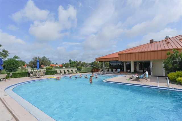 view of pool featuring a patio