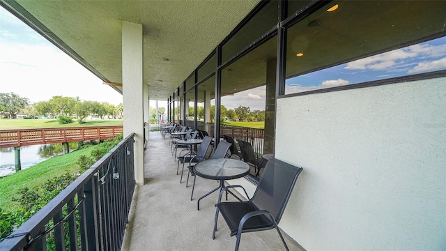 balcony featuring a water view