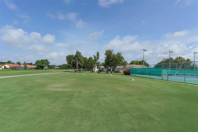 surrounding community with tennis court