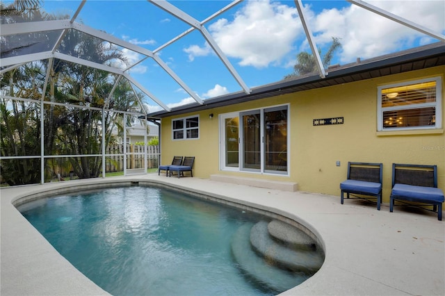 view of pool with a lanai and a patio area