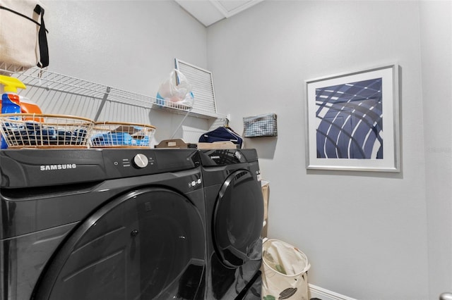 laundry area with separate washer and dryer