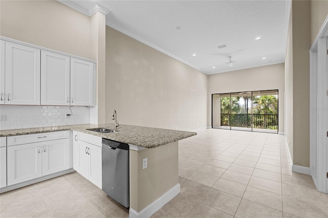 kitchen with decorative backsplash, white cabinetry, kitchen peninsula, light stone countertops, and dishwasher