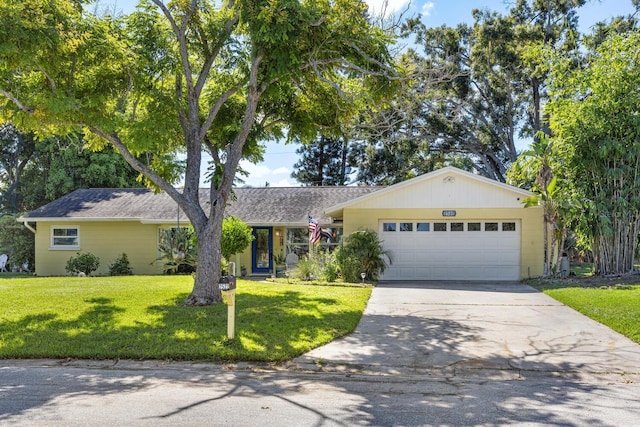 ranch-style home featuring a front yard and a garage