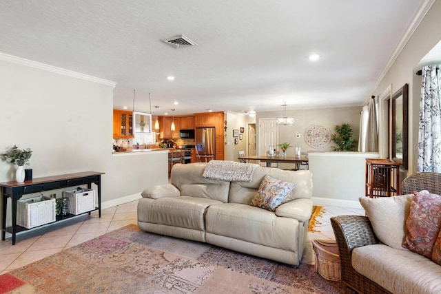 tiled living room featuring ornamental molding and a chandelier