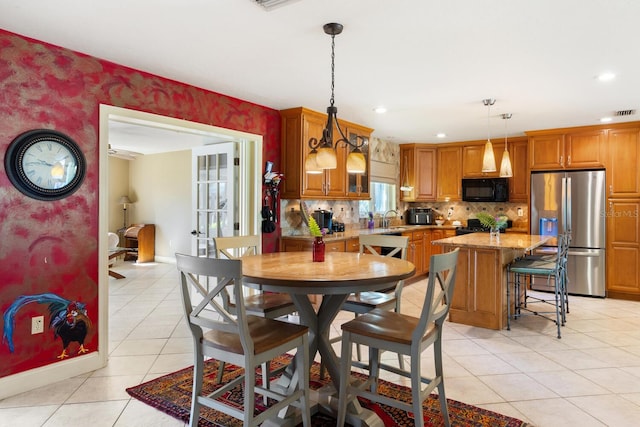 tiled dining area with sink