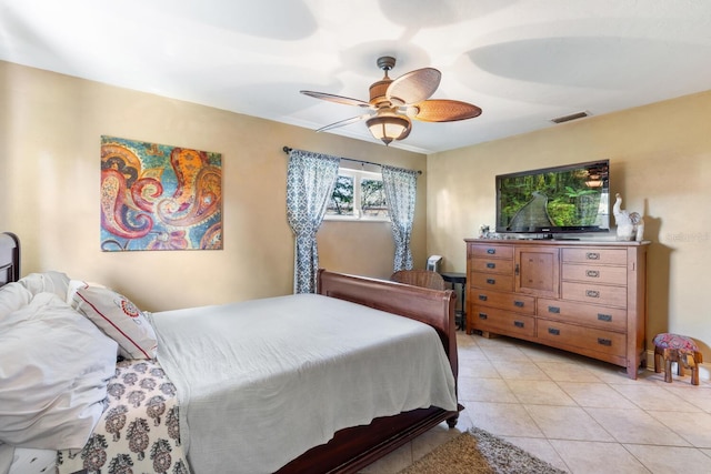 bedroom featuring light tile patterned floors and ceiling fan