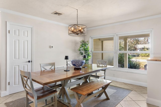 tiled dining room with an inviting chandelier and ornamental molding