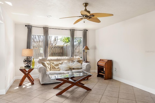 living room with light tile patterned floors and ceiling fan