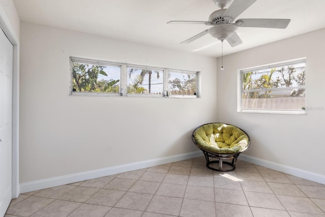 unfurnished room featuring ceiling fan and light tile patterned floors