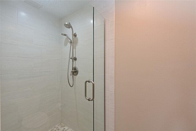 full bathroom featuring a shower stall