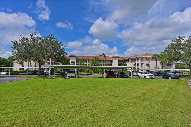 view of property's community with a lawn