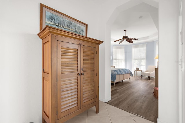 bedroom with ceiling fan and light hardwood / wood-style floors