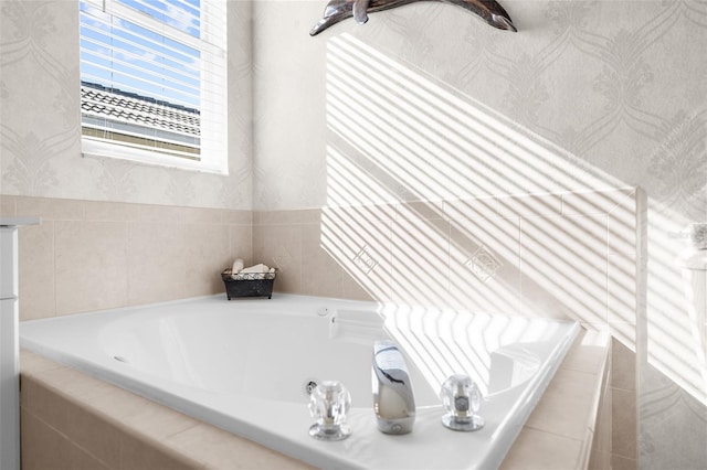 bathroom with a relaxing tiled tub