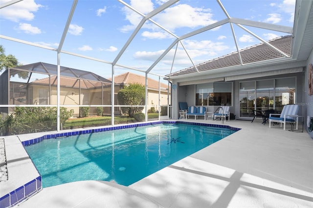 view of swimming pool with a lanai and a patio