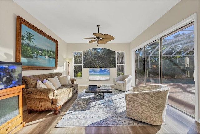 sunroom / solarium featuring a wealth of natural light and ceiling fan