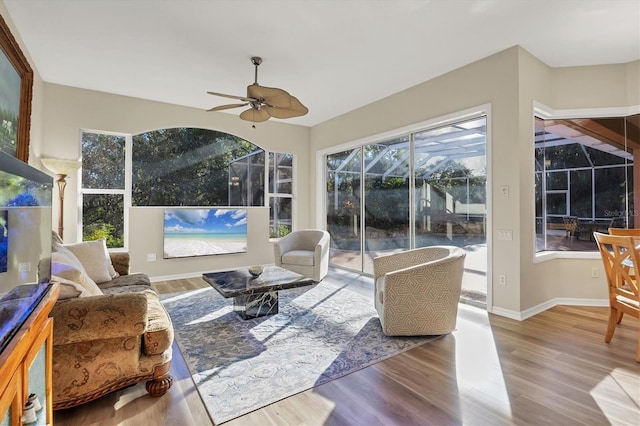 sunroom featuring ceiling fan