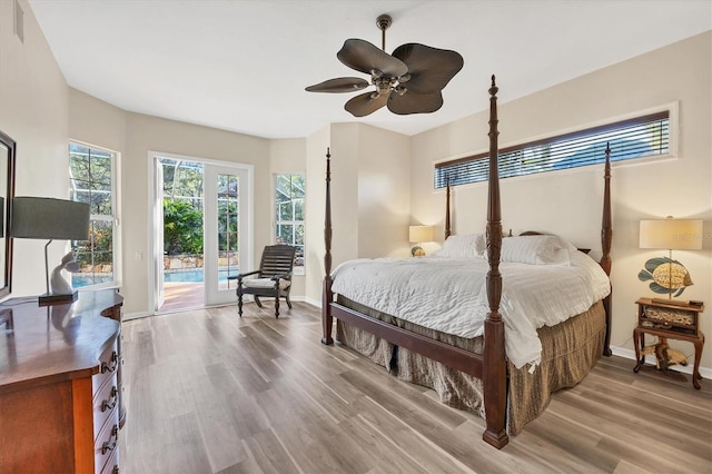 bedroom featuring access to outside, ceiling fan, and wood-type flooring