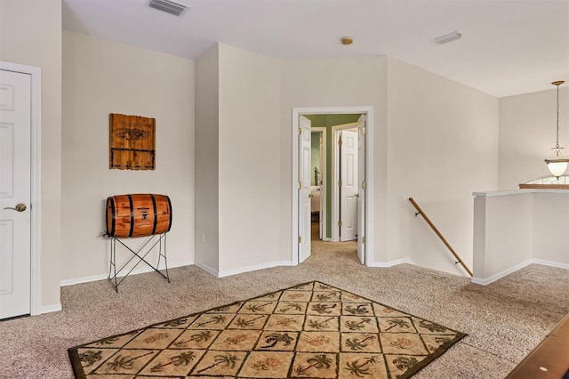 hallway featuring carpet flooring