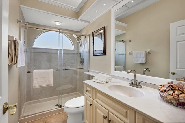 bathroom with vanity, tile patterned floors, toilet, ornamental molding, and walk in shower