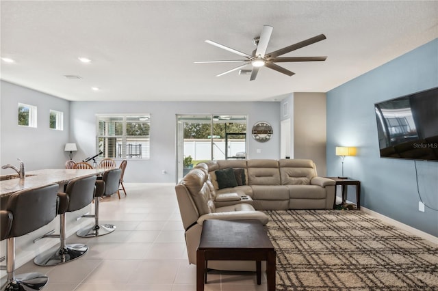 living room with sink and ceiling fan