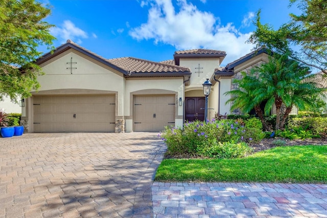 mediterranean / spanish-style house featuring a garage