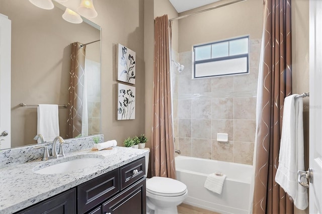 full bathroom featuring vanity, toilet, and shower / bathtub combination with curtain