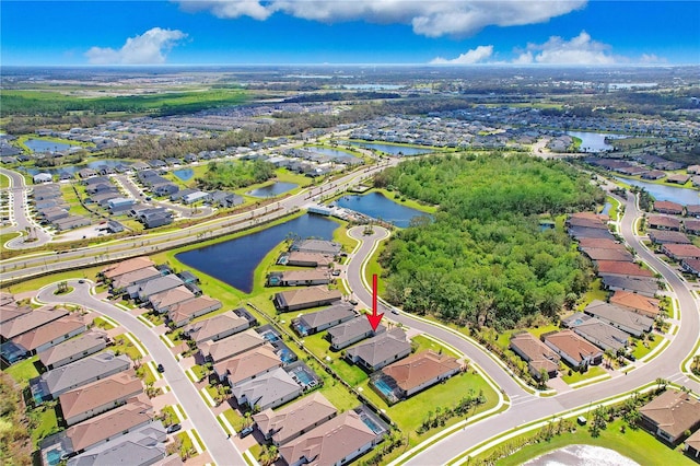 birds eye view of property with a water view