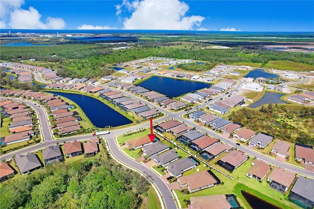 birds eye view of property featuring a water view