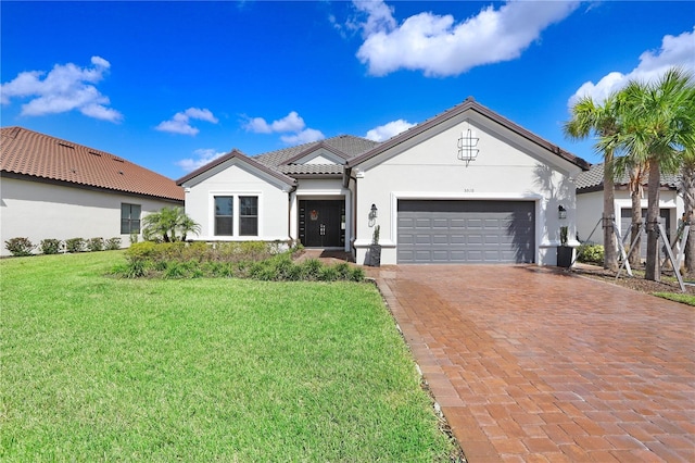 view of front of home with a front lawn and a garage