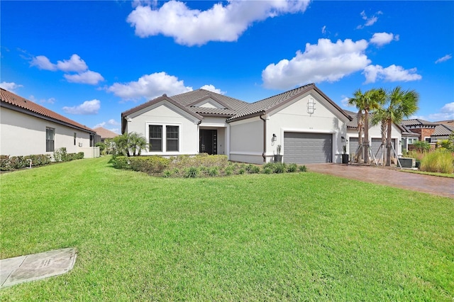 view of front facade with a front lawn and a garage