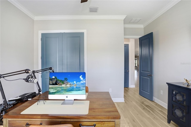 office space featuring ornamental molding and light hardwood / wood-style flooring