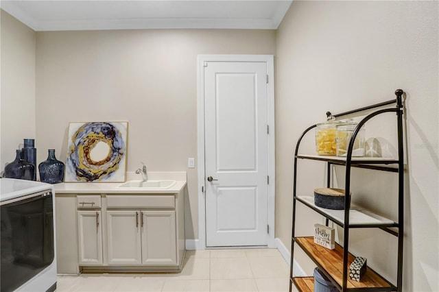 washroom with ornamental molding, sink, and light tile patterned floors