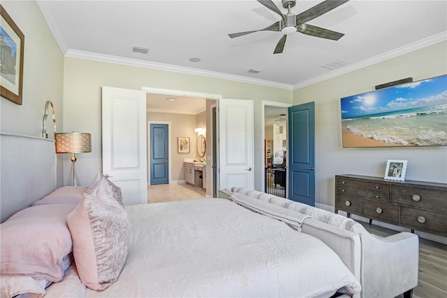 bedroom with ceiling fan, ornamental molding, ensuite bathroom, and light wood-type flooring